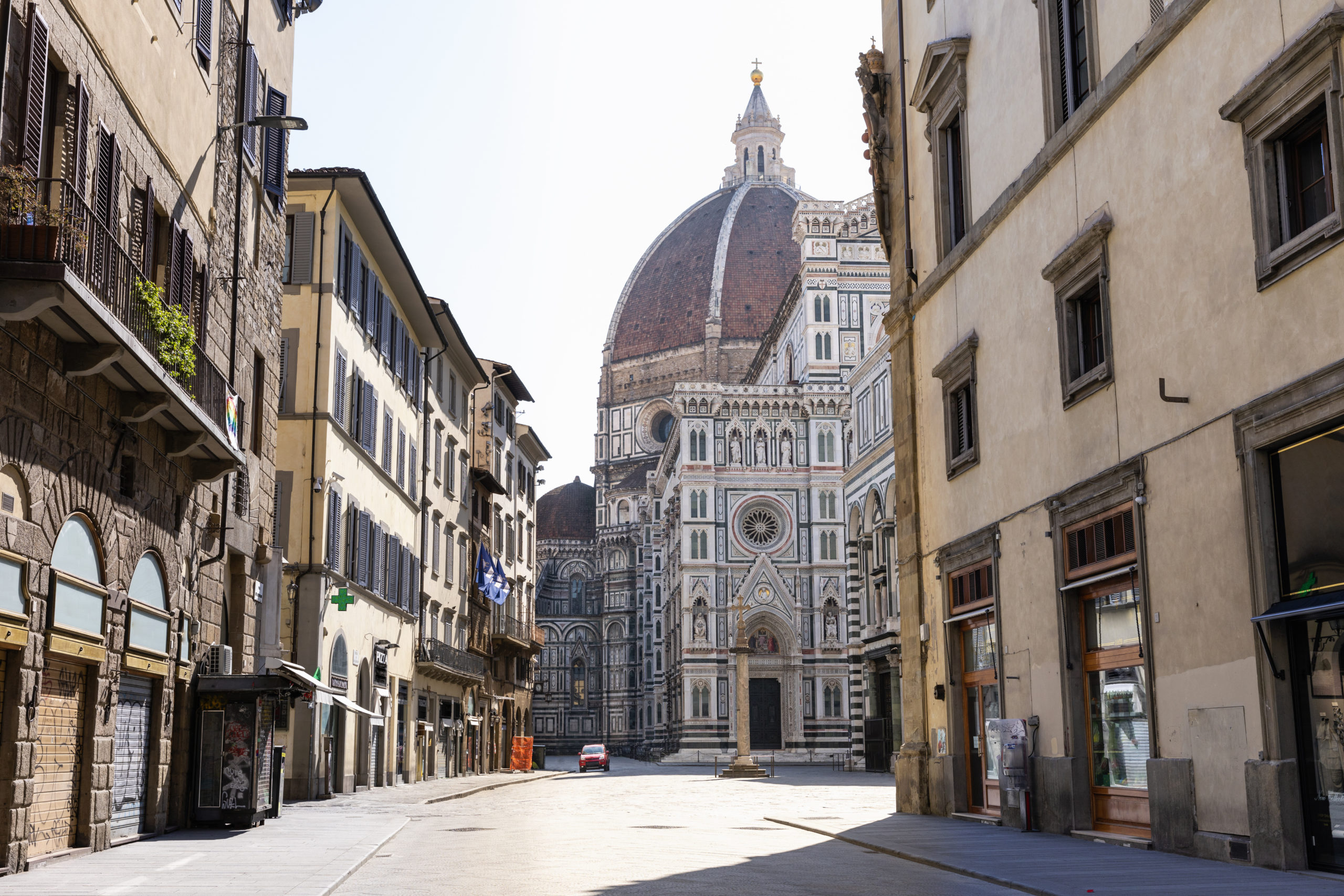 View down an empty street towards the Duomo di Santa Maria del Fiore in Florence, Italy during the Corona virus crisis.