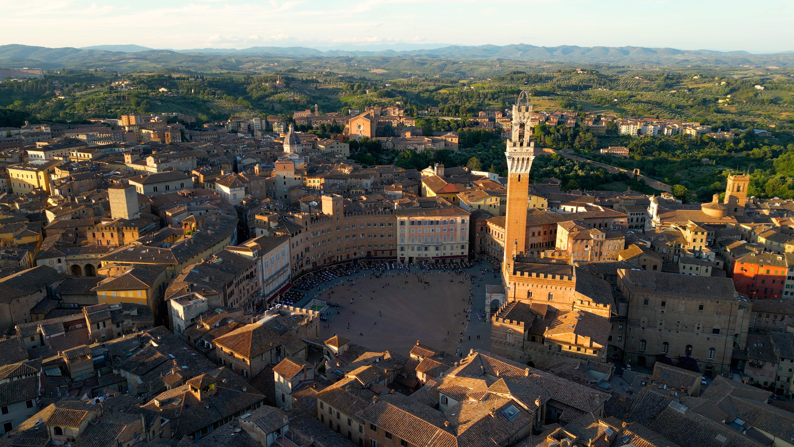 Siena at sunset, Piazza del Campo, Palazzo Pubblico, and Torre del Mangia, Italy